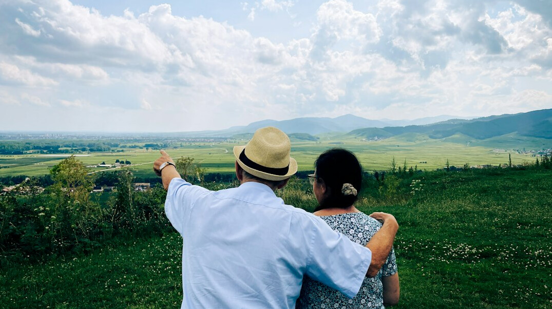 happy retired couple traveling