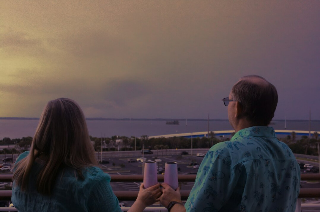 retired couple enjoying sunset
