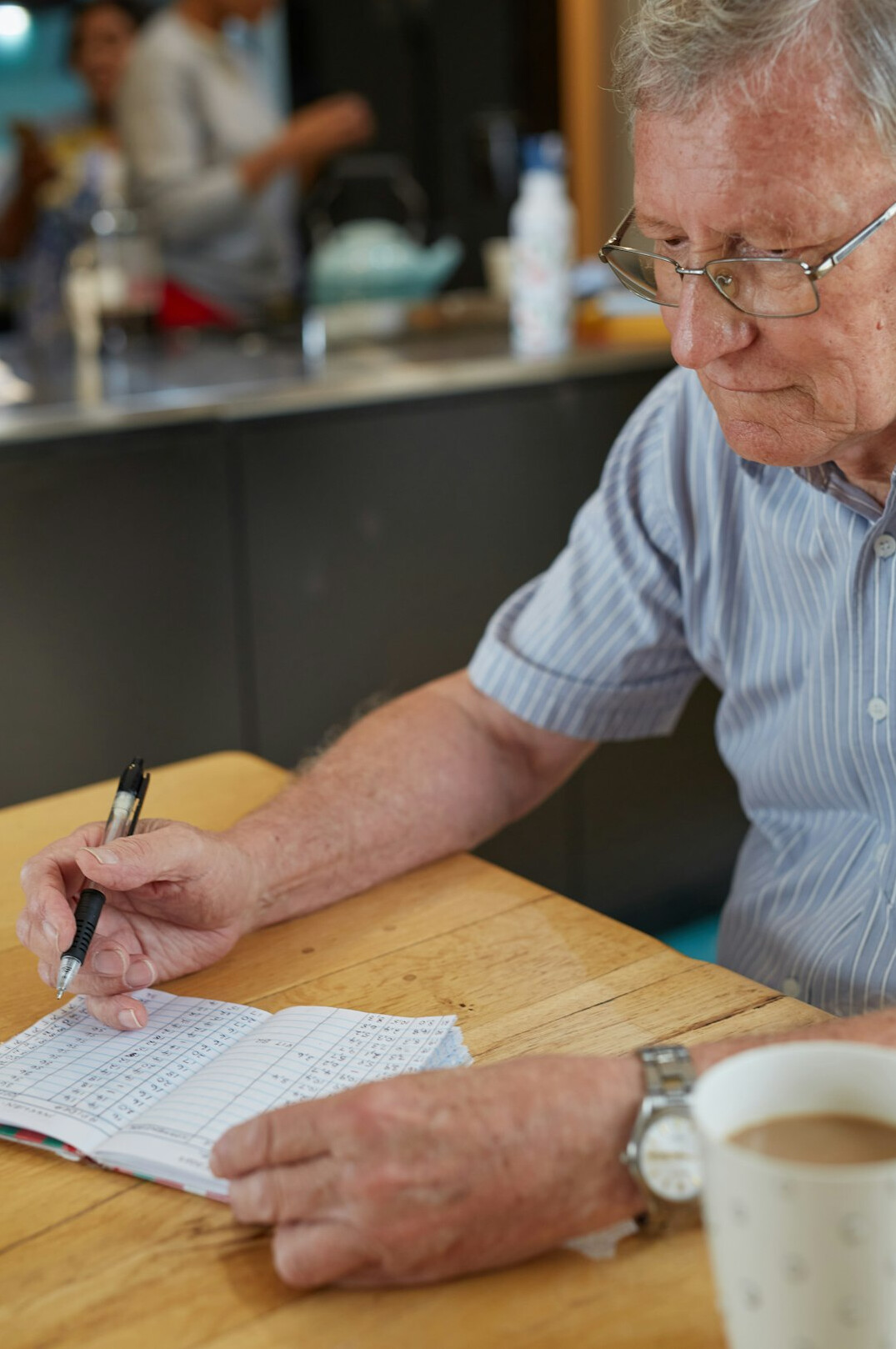 elderly person reviewing documents